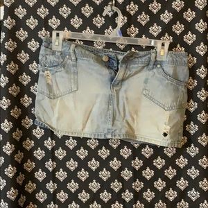 Jean mini skirt. Distressed.
